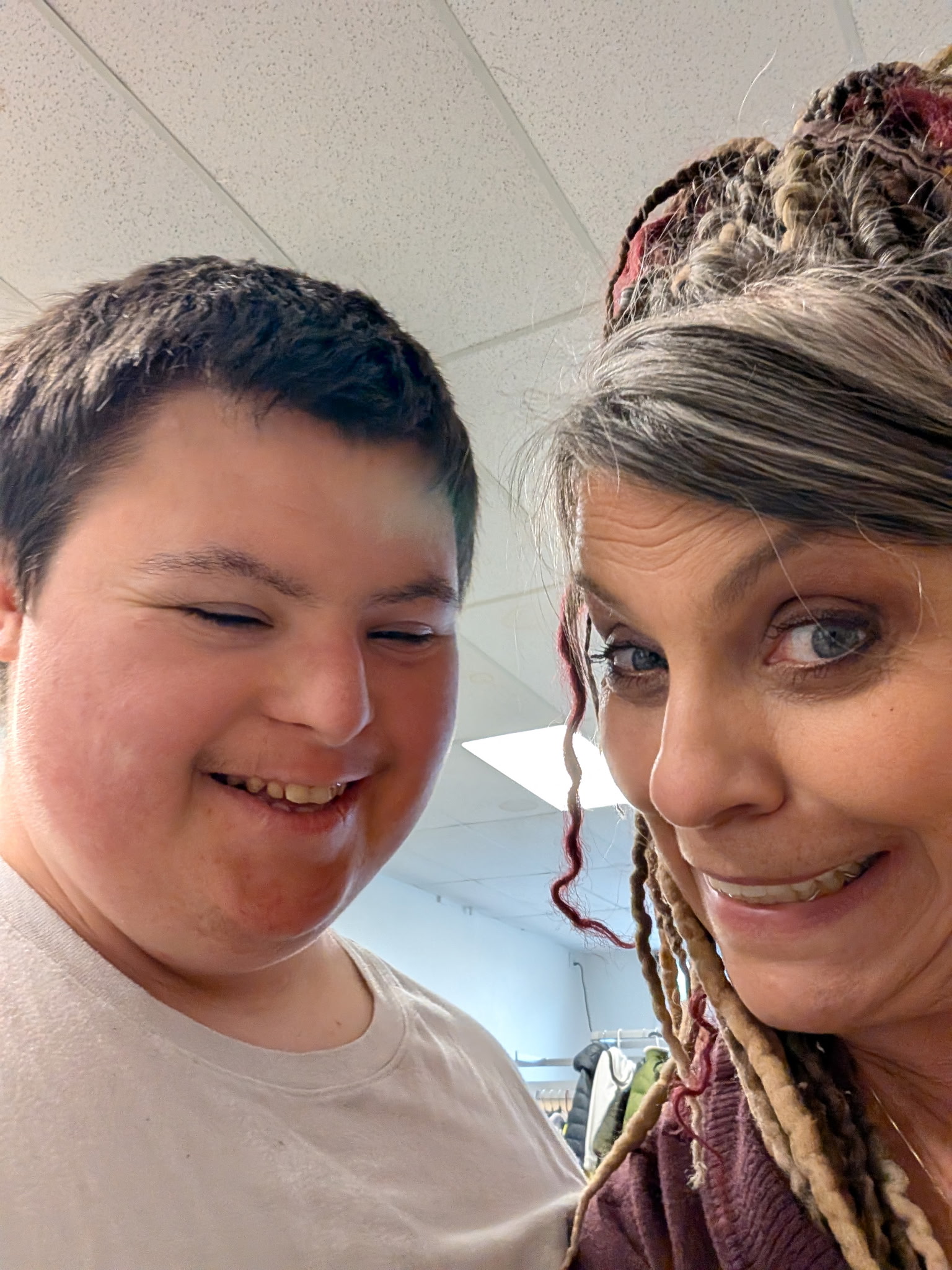 Angel smiling with a young community member