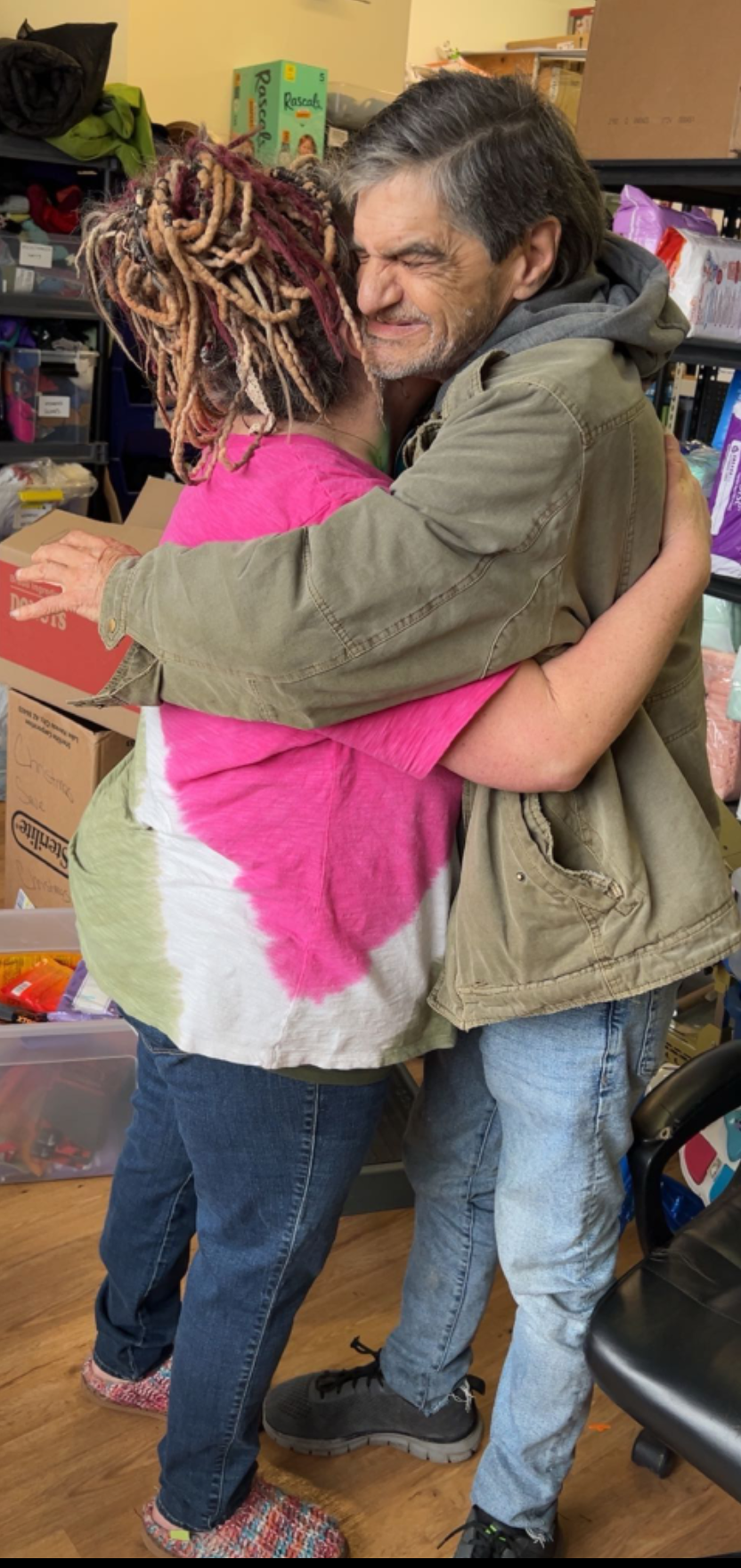 Angel embracing a community member