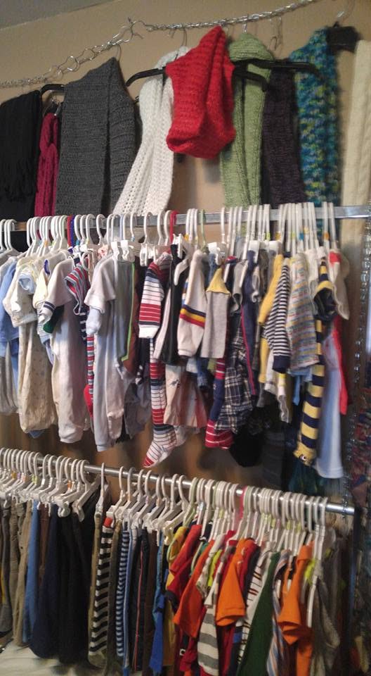 Early clothing racks organized by size