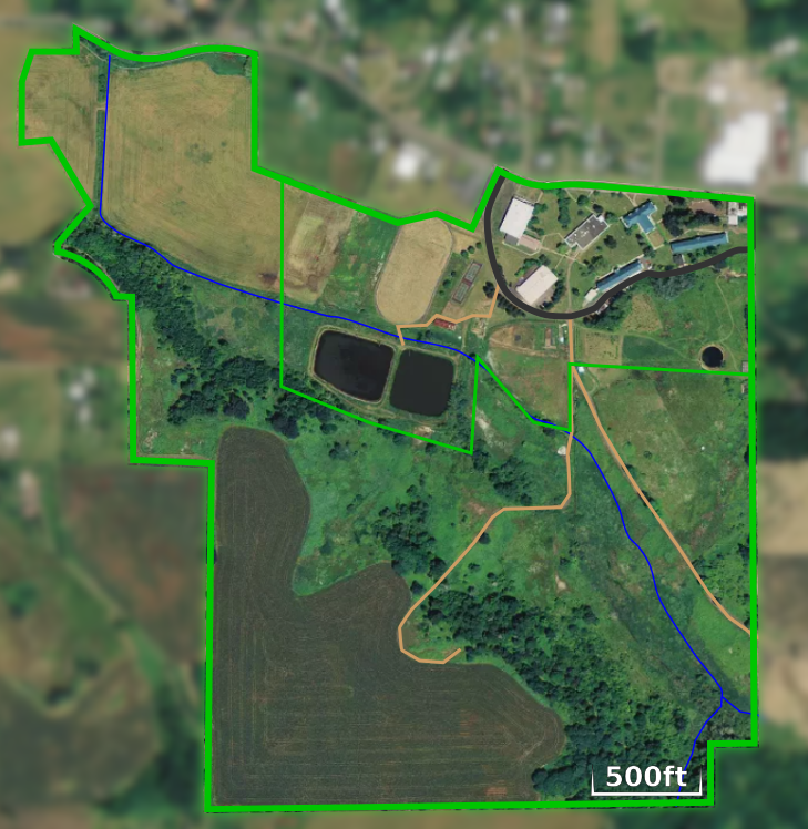 Overhead campus map showing buildings, roads, fields, and outdoor areas